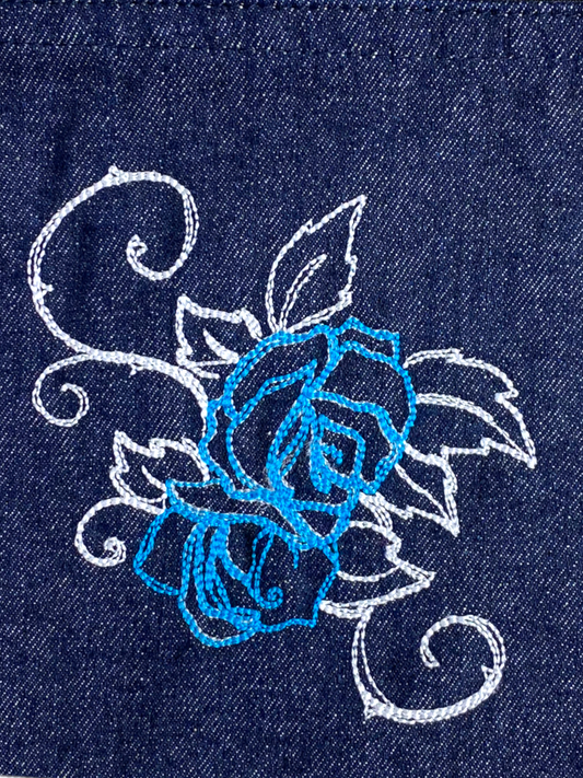 Denim bag with light blue and white rose detail