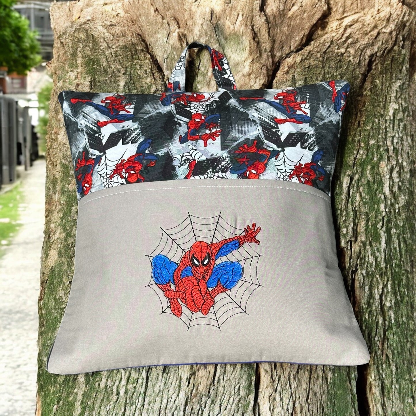 Handcrafted Read Pillow - Man Spinning Web