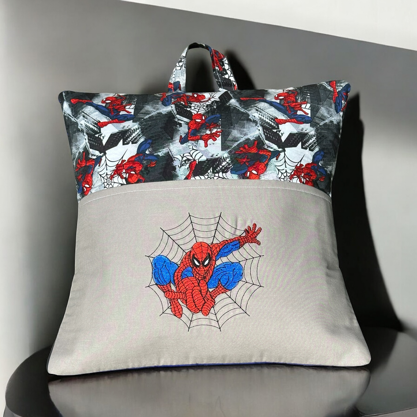 Handcrafted Read Pillow - Man Spinning Web