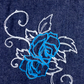 Denim bag with light blue and white rose detail